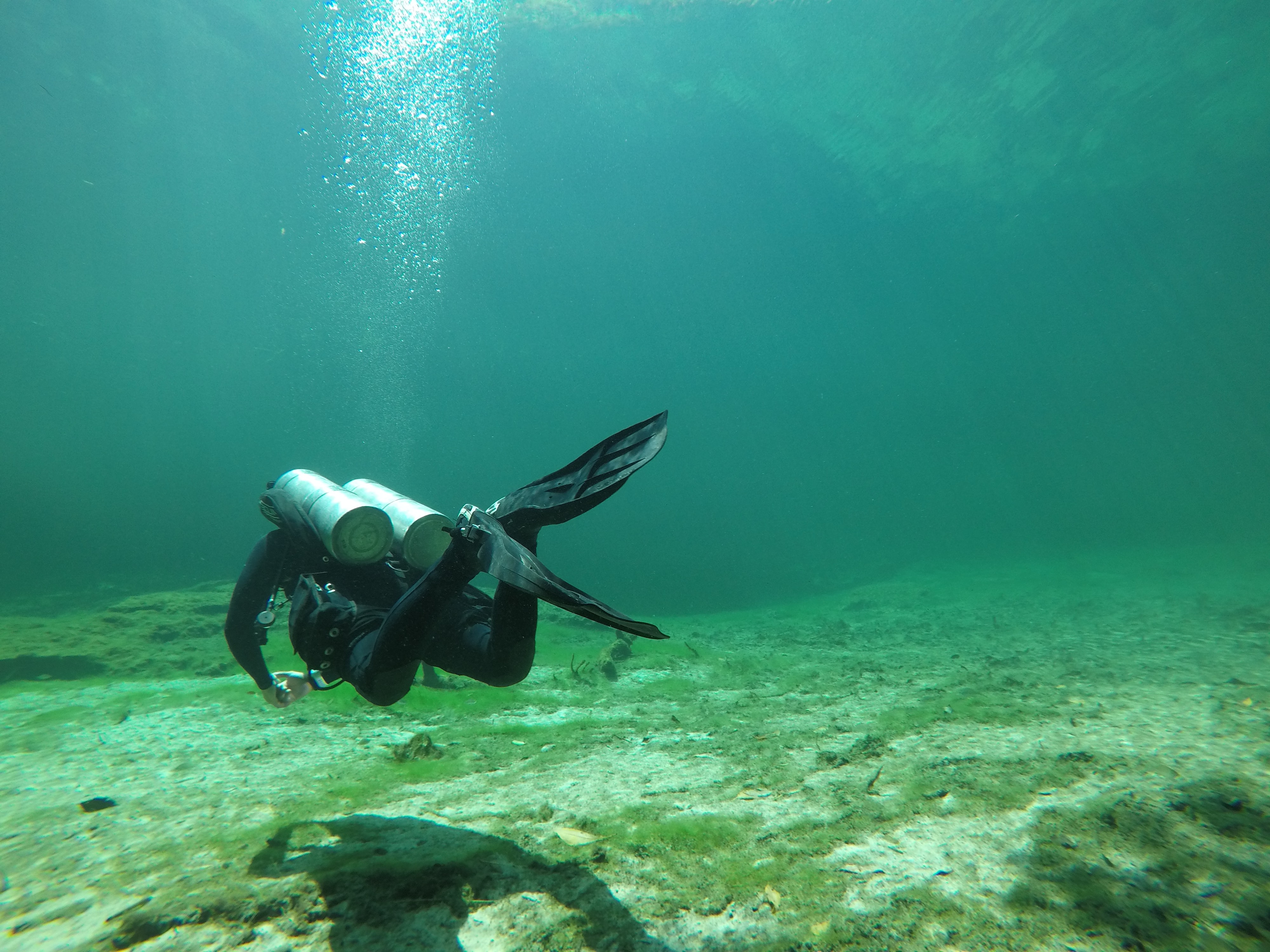 Scuba diver in Cancun exploring the underwater statues Scuba diver in Cancun exploring the underwater statues
