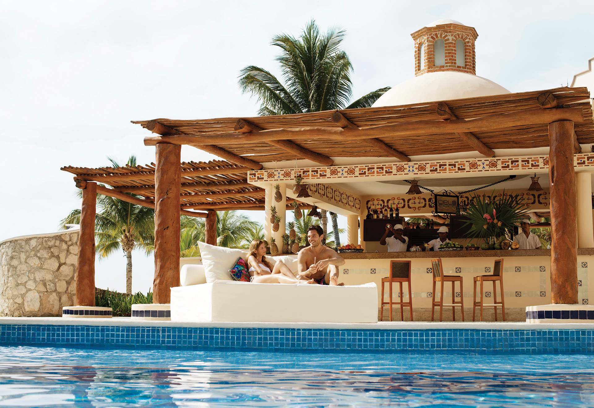 Man and woman enjoying their All Inclusive resort without worrying about money Man and woman enjoying their All Inclusive resort without worrying about money