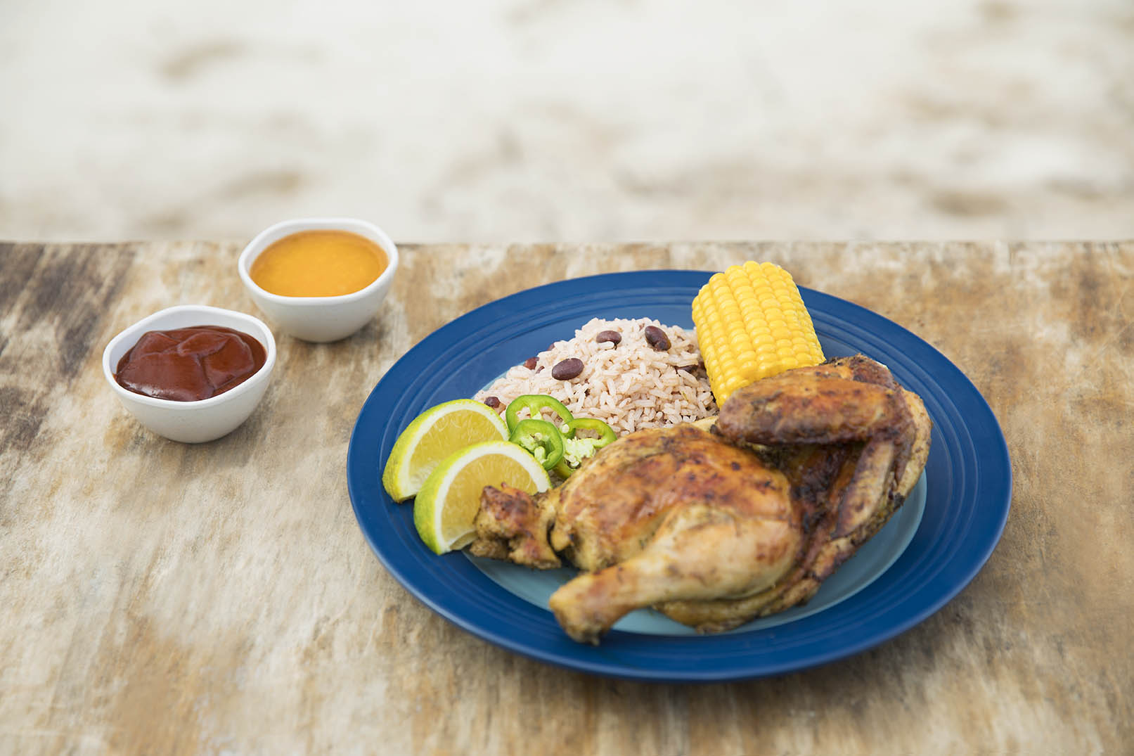 A plate of Jamaican jerk chicken with coconut rice A plate of Jamaican jerk chicken with coconut rice